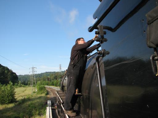 crew member on catwalk just in front of cab