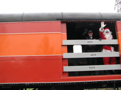 Santa waves from baggage door